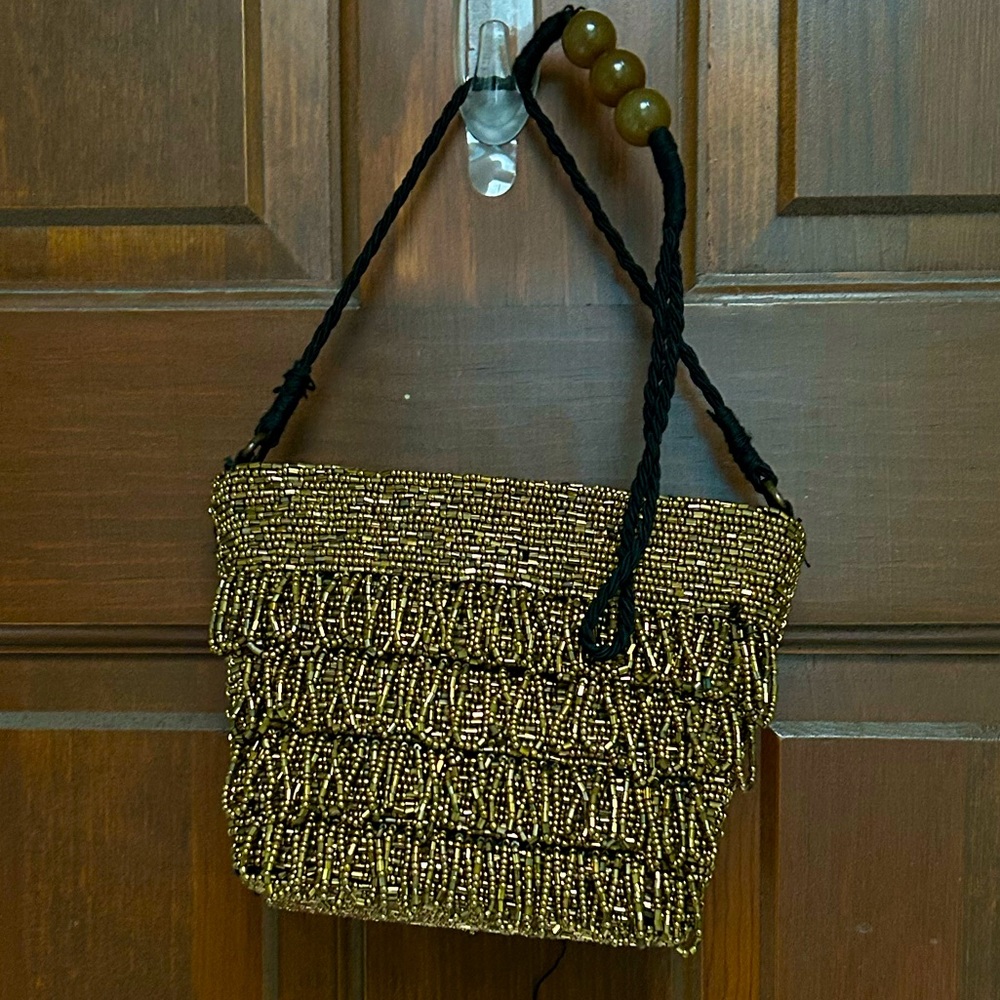 Pre-loved Glitzy zip top handbag, some seed beads fell off. By Zara